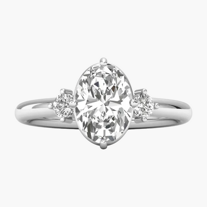 Diamond ring with a pear-shaped center stone on a white background