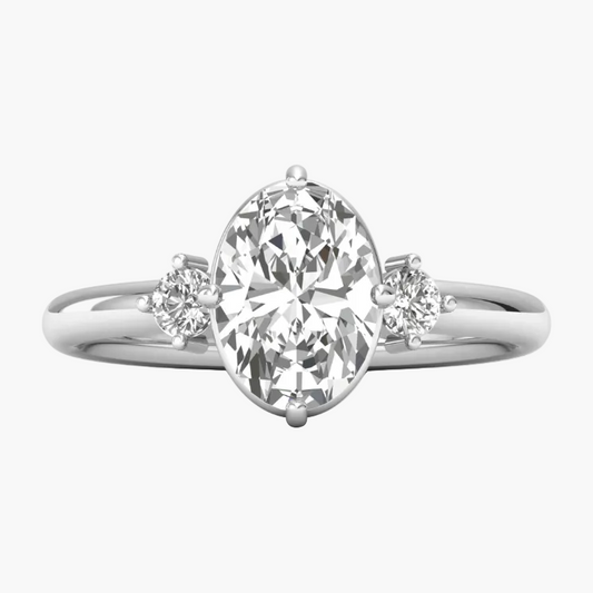 Diamond ring with a pear-shaped center stone on a white background