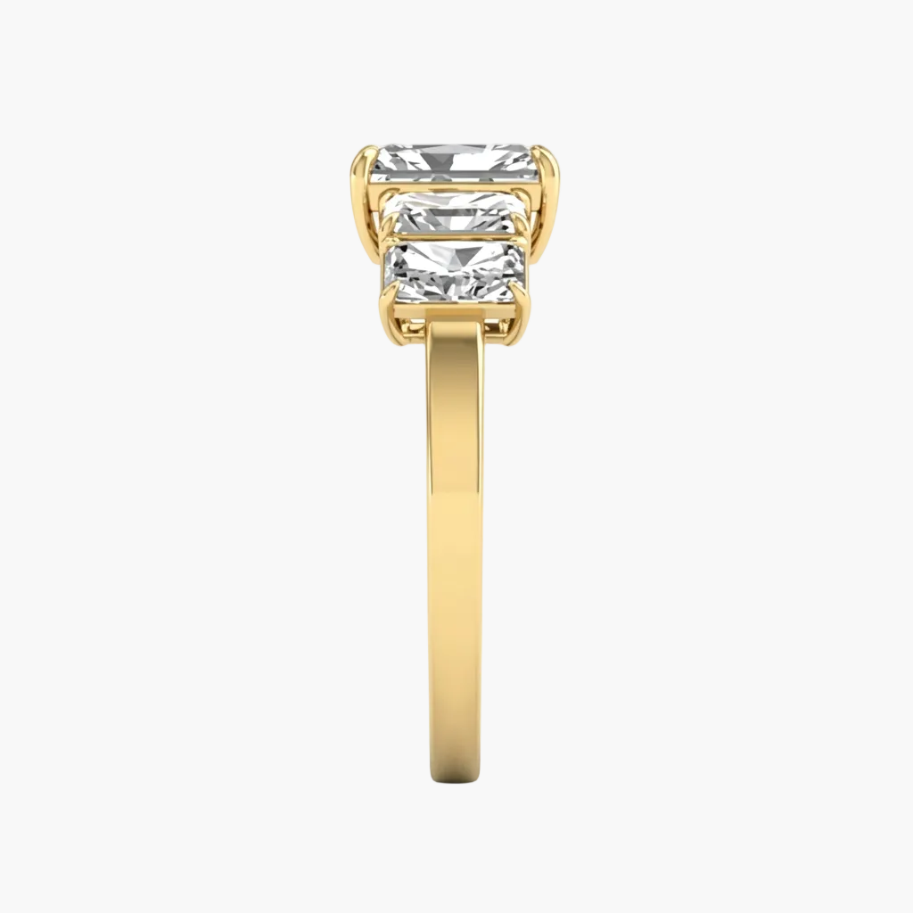 Gold ring with a large diamond on a white background