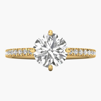 Gold ring with a large diamond and smaller diamonds on the band against a white background