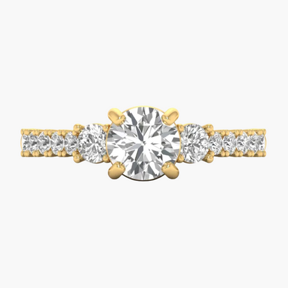 Gold ring with three prominent diamonds on a white background