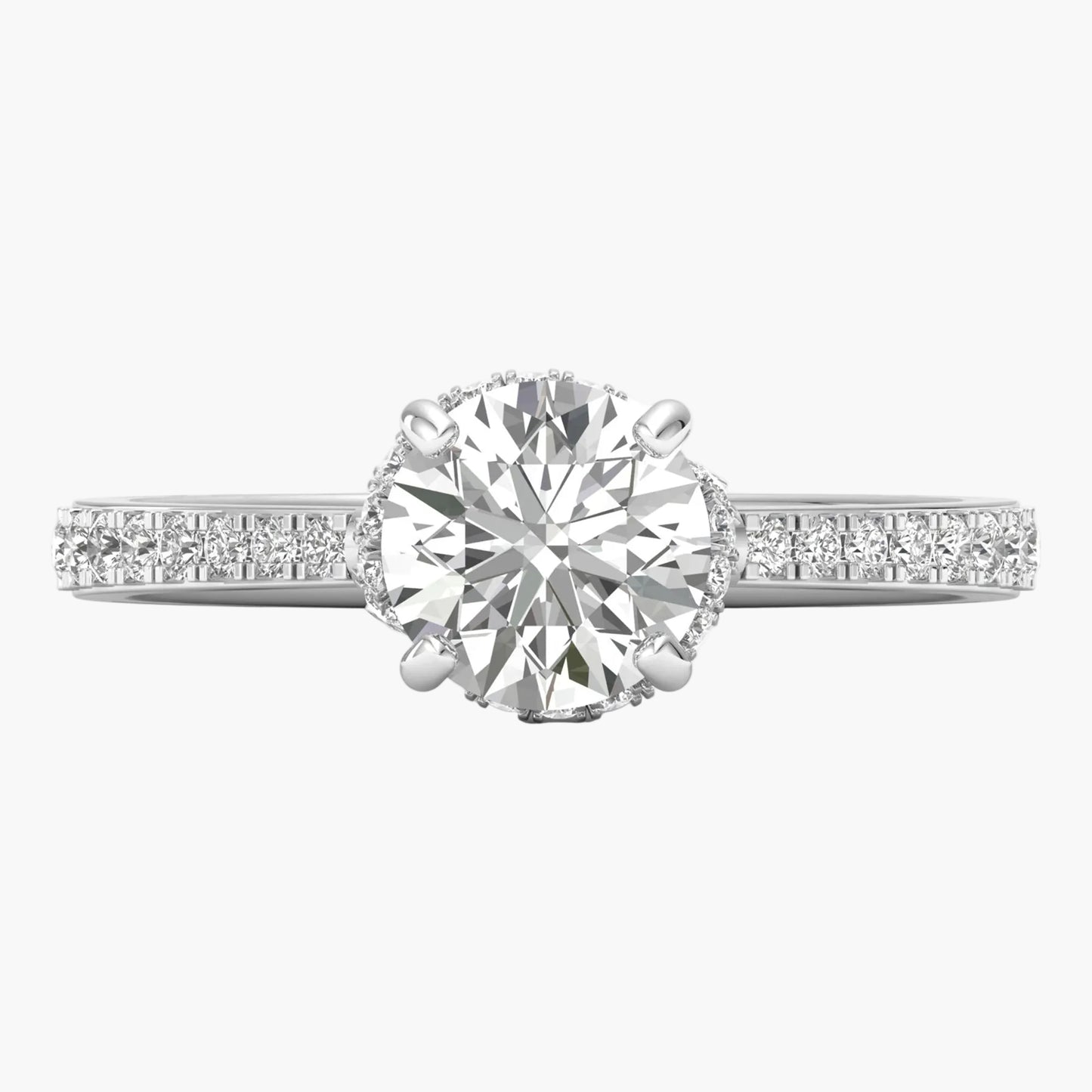 Diamond ring with a large central gemstone and smaller stones on the band against a white background