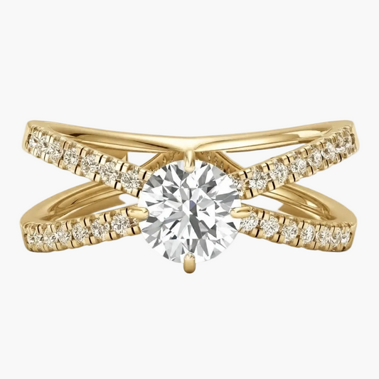 A yellow gold double-band ring featuring a large round-cut center stone and pavé-set accent stones along the curved bands, shown on a clean white background.