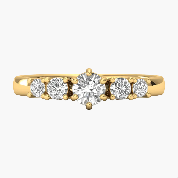 Gold ring with five diamonds on a white background