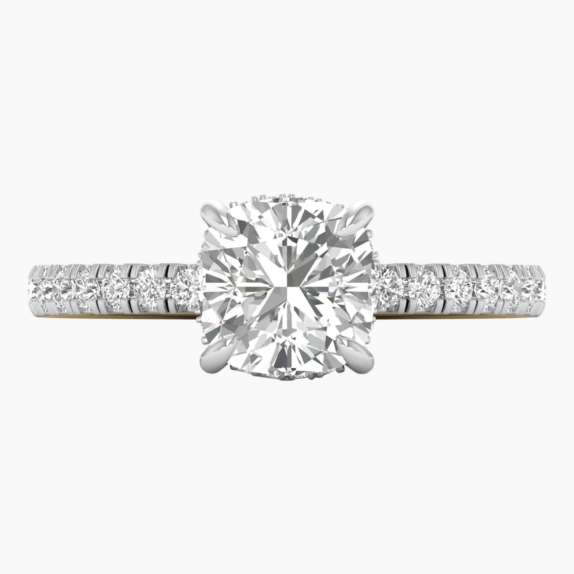 Diamond ring with a large central gemstone and smaller stones on the band against a white background