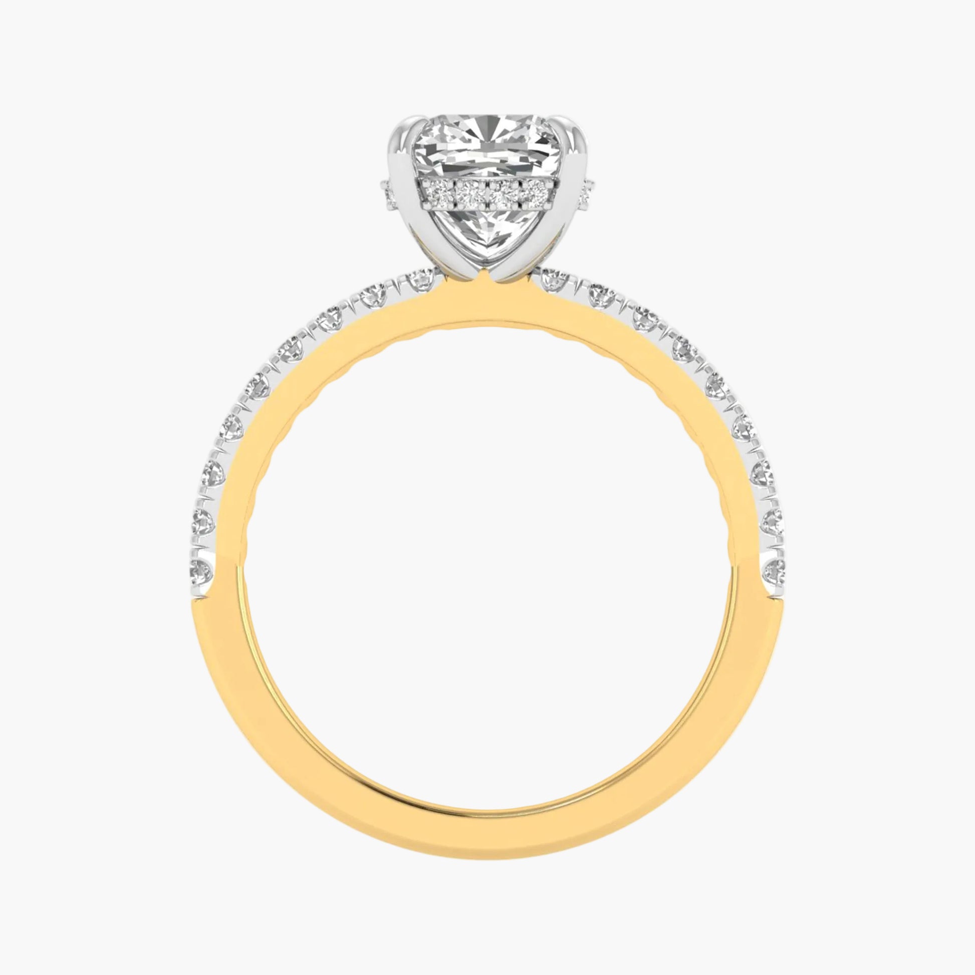 Two-tone gold ring with a diamond heart-shaped center on a white background