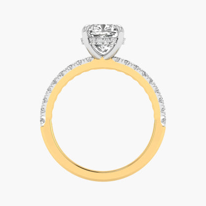 Two-tone gold ring with a diamond heart-shaped center on a white background