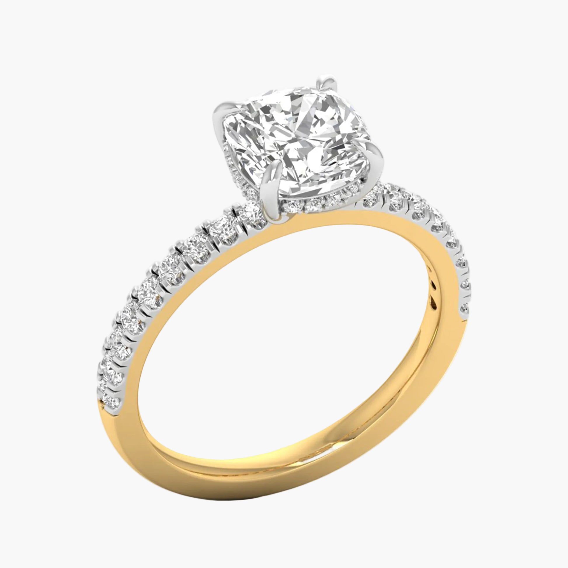 Two-tone gold ring with a large diamond and smaller diamonds on the band against a white background