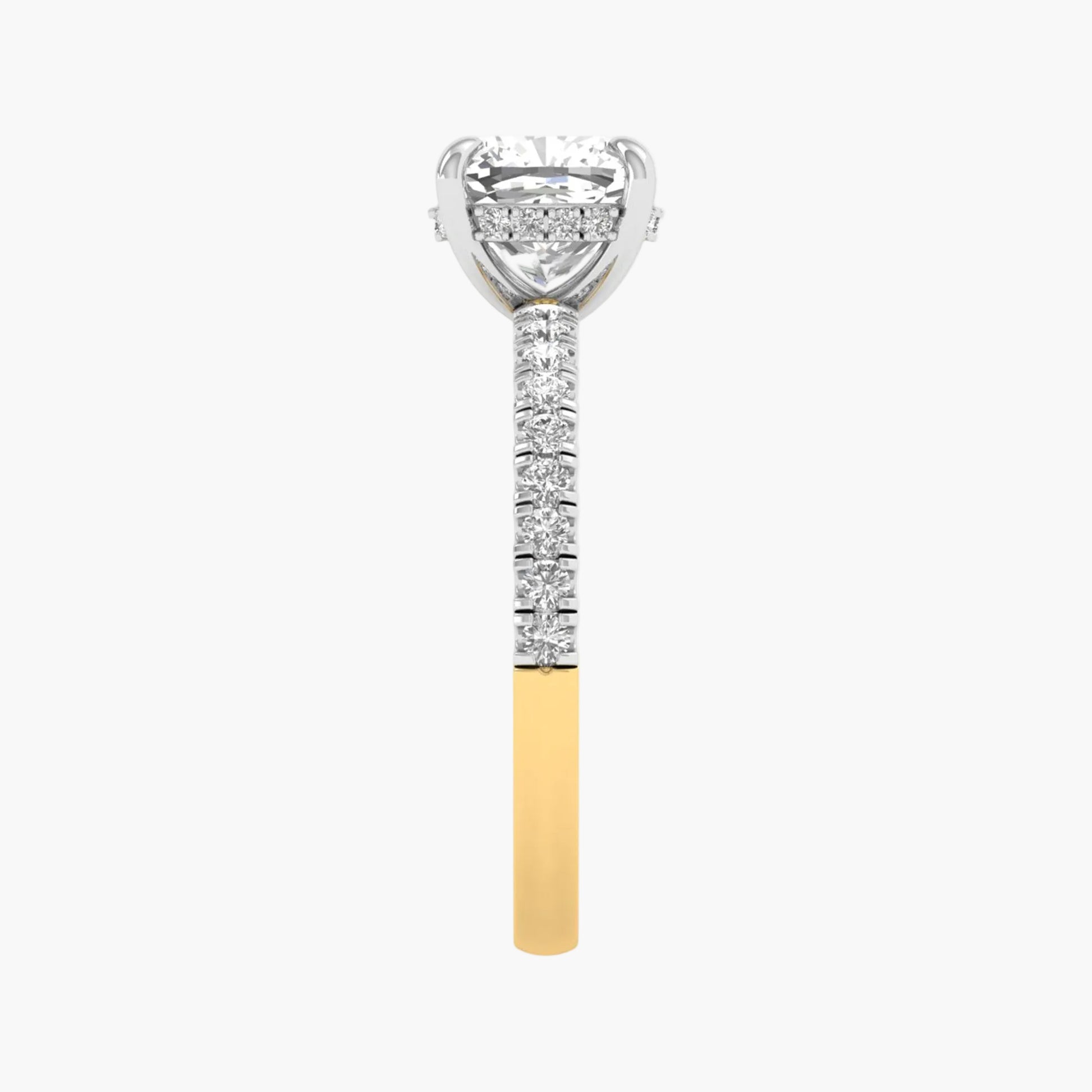 Diamond-studded ring with a yellow gold band on a white background