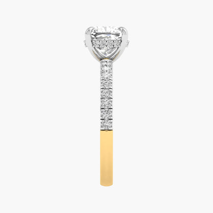 Diamond-studded ring with a yellow gold band on a white background