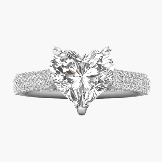 Diamond ring with a heart-shaped center stone on a white background