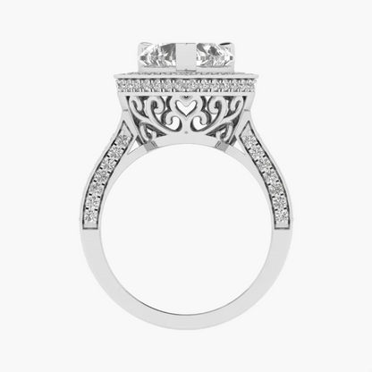 Silver ring with intricate design and diamond accents on a white background