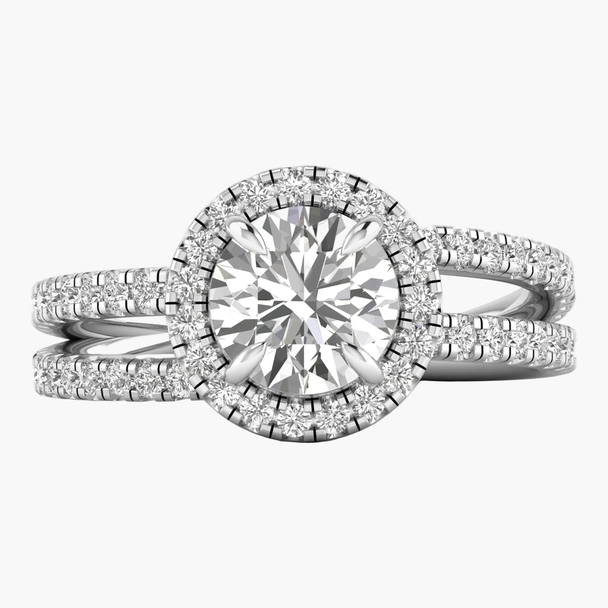 Diamond ring with a halo setting on a white background