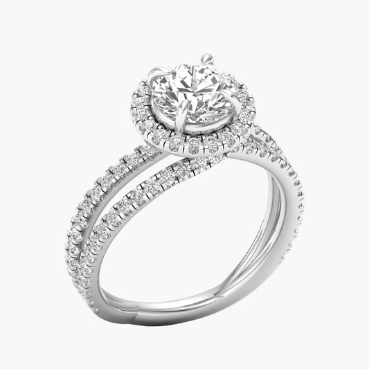 Diamond ring with a halo and side stones on a white background