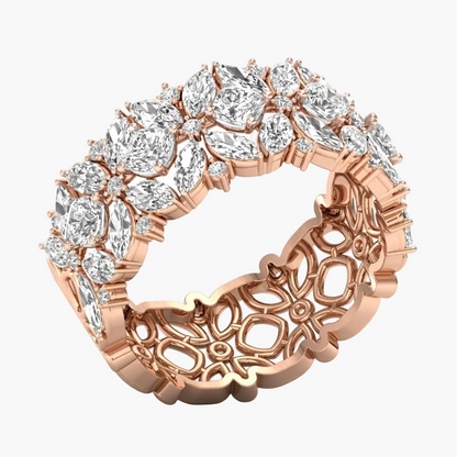 Rose gold ring with diamond accents on a white background