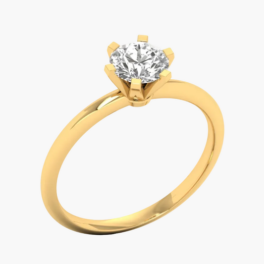 Gold ring with a diamond on a white background