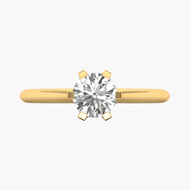 Gold ring with a diamond on a white background