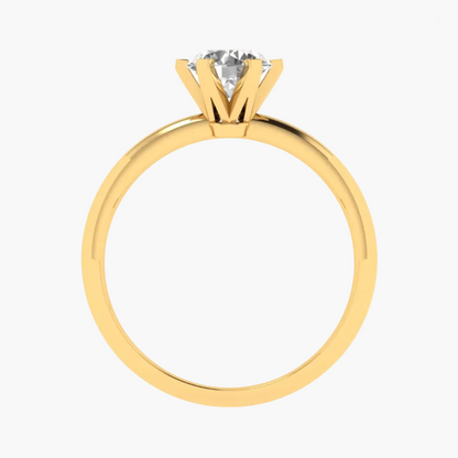 Gold ring with a diamond on a white background