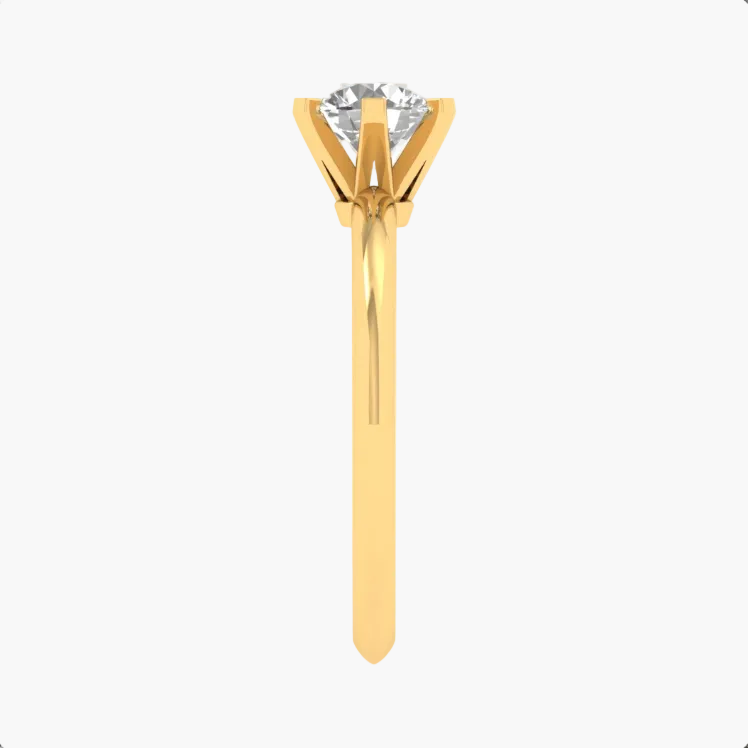 Gold ring with a diamond on a white background