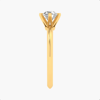 Gold ring with a diamond on a white background