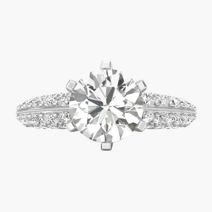 Diamond ring with a large central gemstone and smaller stones on a white background