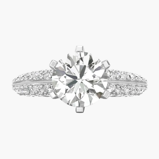 Diamond ring with a large central gemstone and smaller stones on a white background