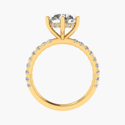 Gold ring with a large central diamond and smaller diamonds around on a white background