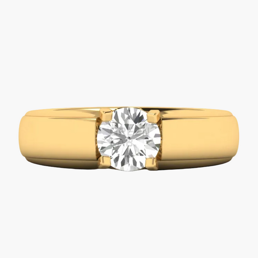 A yellow gold solitaire ring with a round brilliant-cut diamond set in a four-prong setting, shown on a plain white background.