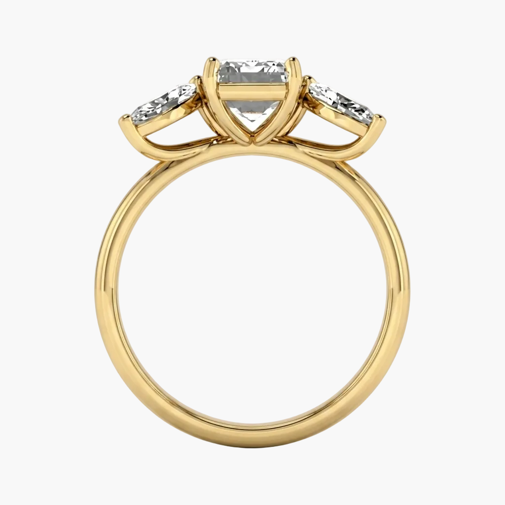 Gold ring with a central diamond and two smaller diamonds on a white background