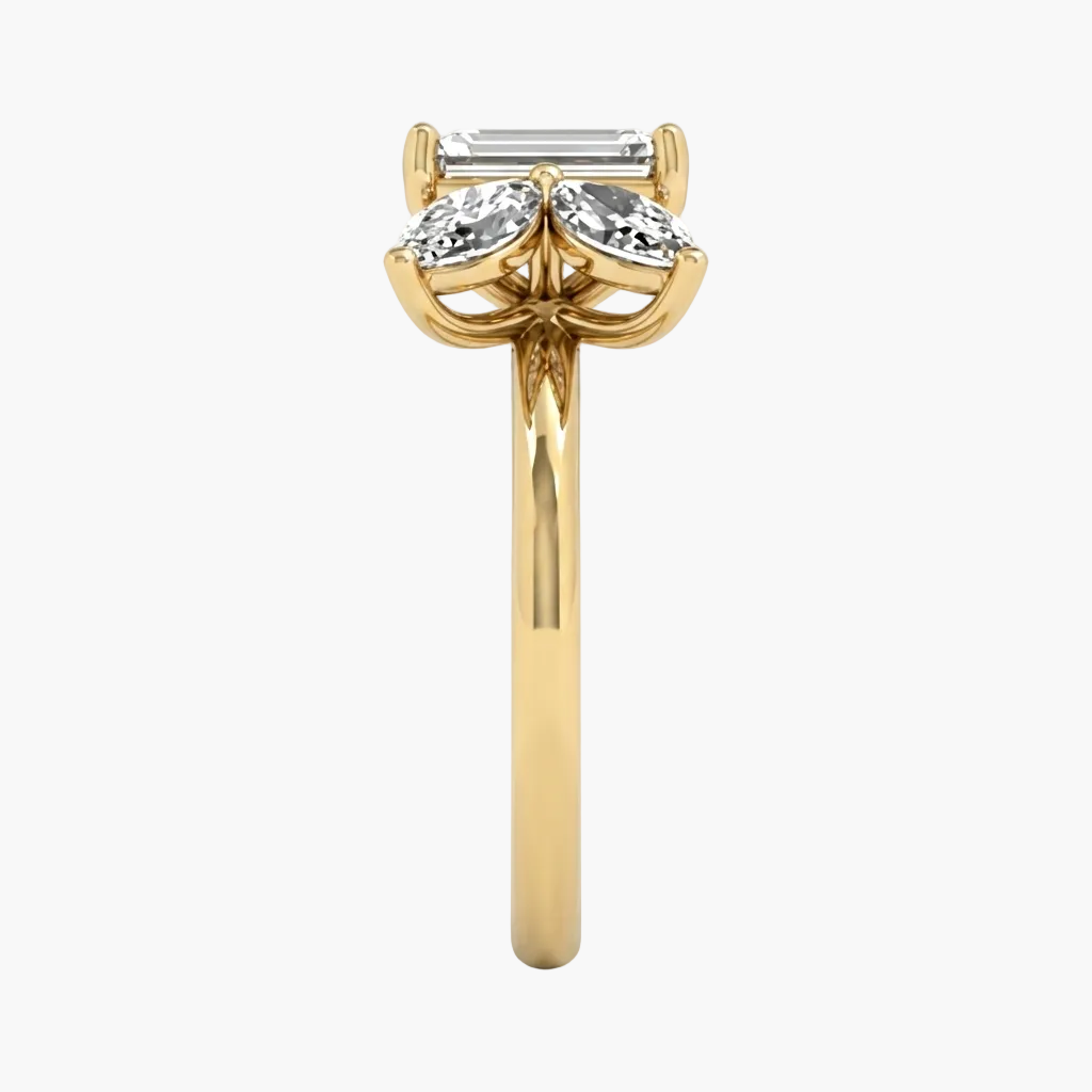 Gold ring with three diamonds on a white background