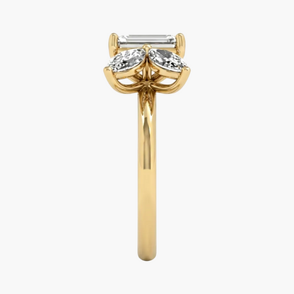 Gold ring with three diamonds on a white background