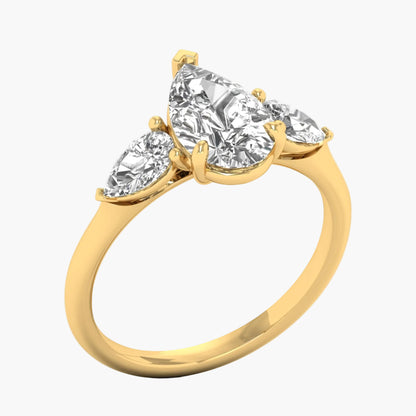 Gold ring with three pear-shaped diamonds on a white background