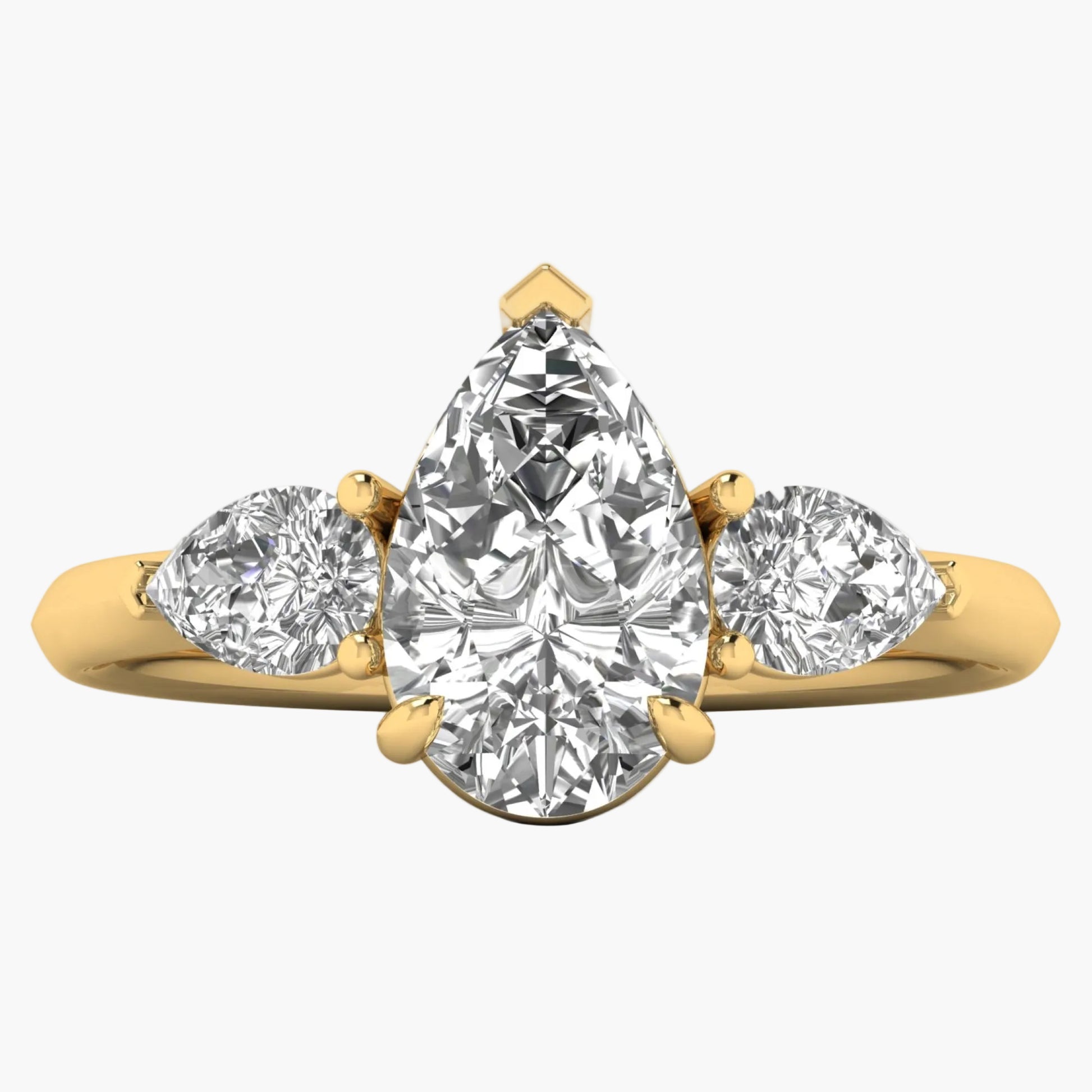 Gold ring with three pear-shaped diamonds on a white background