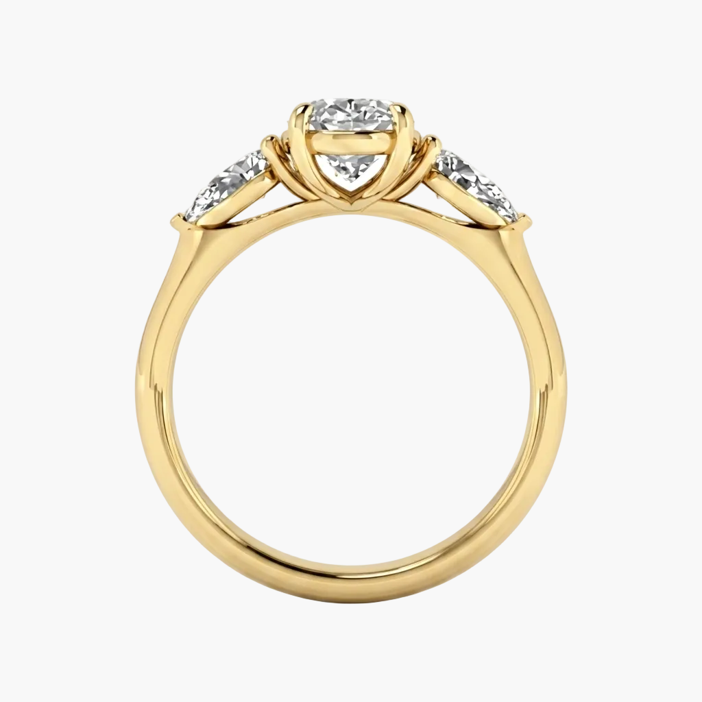 Gold ring with a heart-shaped center stone and smaller stones on a white background, featuring the brand 'Green Lab'.