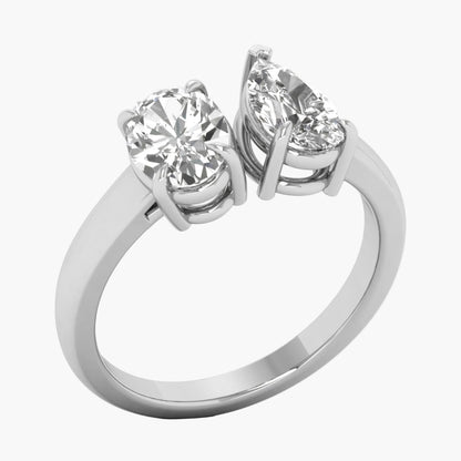 Silver ring with two diamonds on a white background