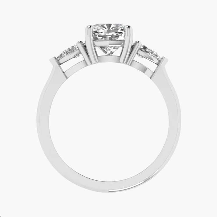 Diamond ring with three stones on a white background