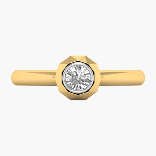 Gold ring with a diamond on a white background