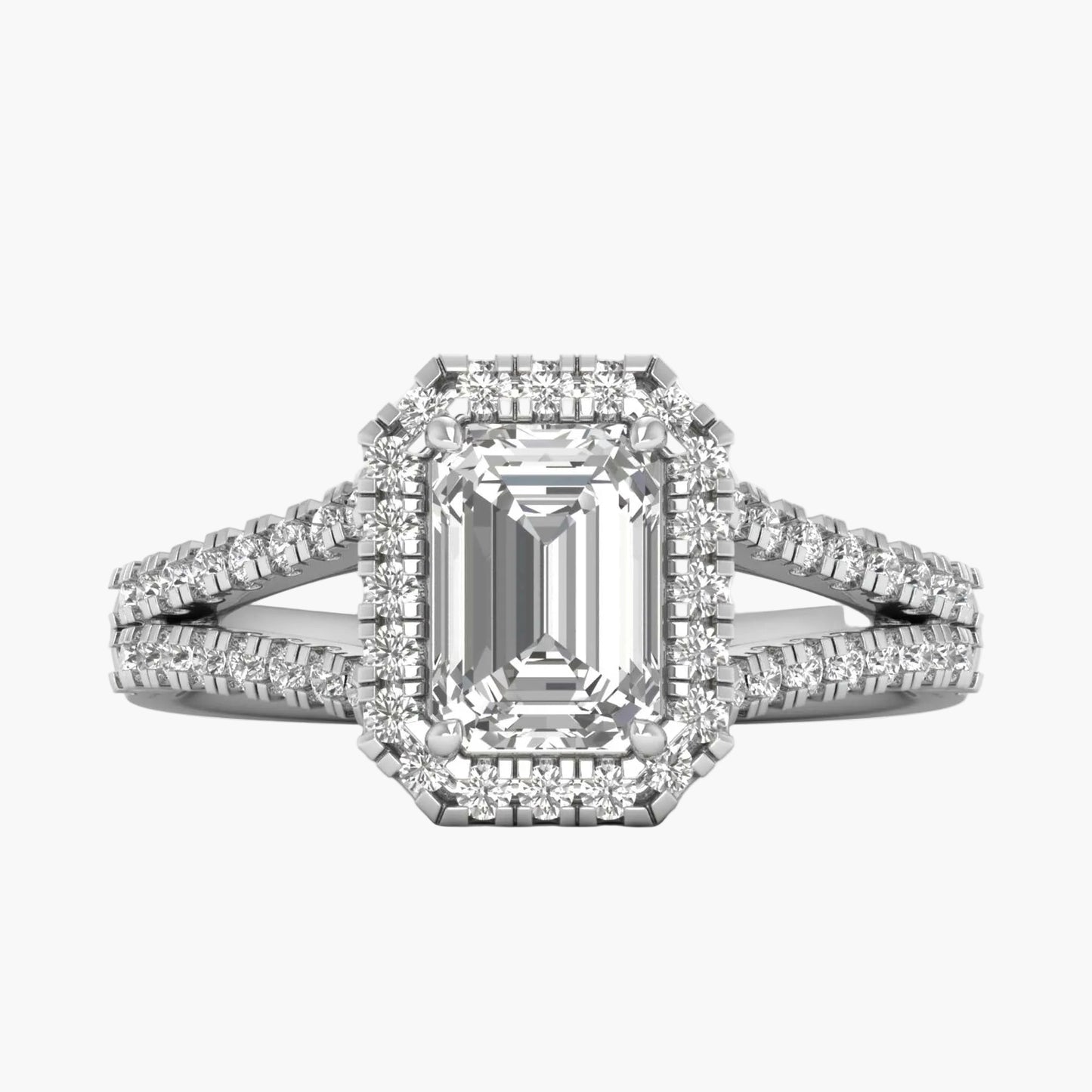 Diamond ring with emerald-cut center stone on a white background