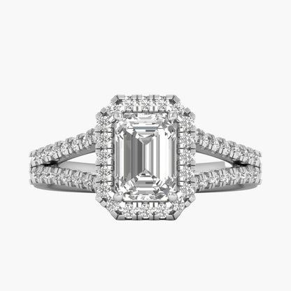 Diamond ring with emerald-cut center stone on a white background