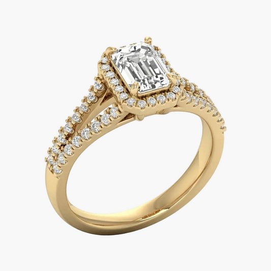 Gold ring with a large diamond and smaller diamonds on the band against a white background