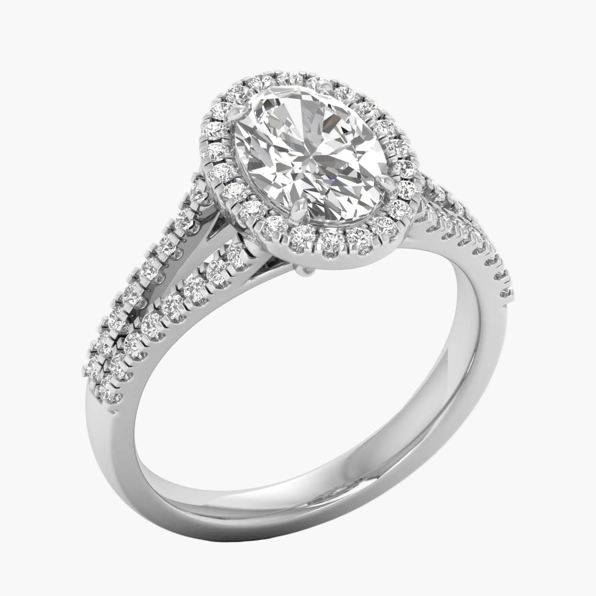 Diamond ring with a halo and side stones on a white background