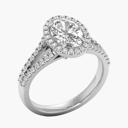 Diamond ring with a halo and side stones on a white background