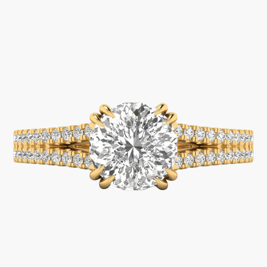 Gold ring with a large diamond and smaller diamonds on the band against a white background