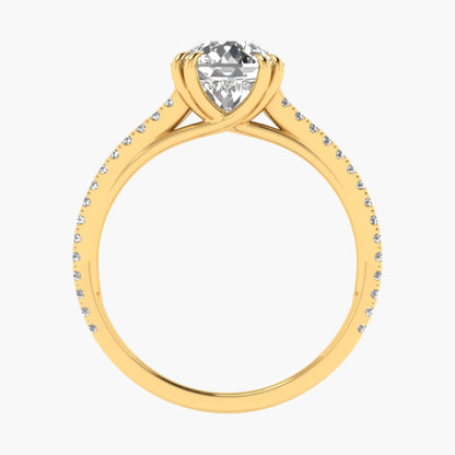 Gold ring with a heart-shaped diamond on a white background