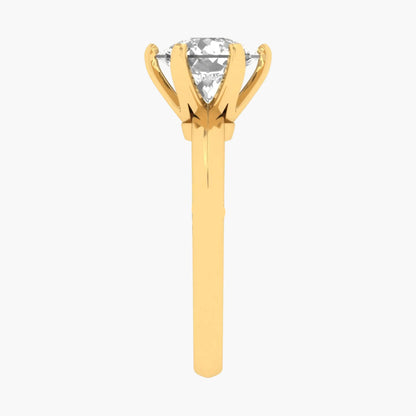 Gold ring with a clear gemstone on a white background, branded 'Green Lab'.