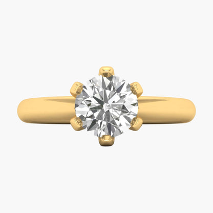 Gold ring with a large diamond on a white background