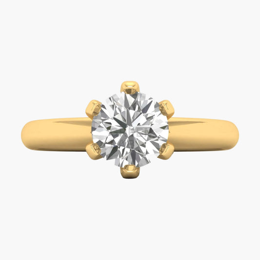 Gold ring with a large diamond on a white background