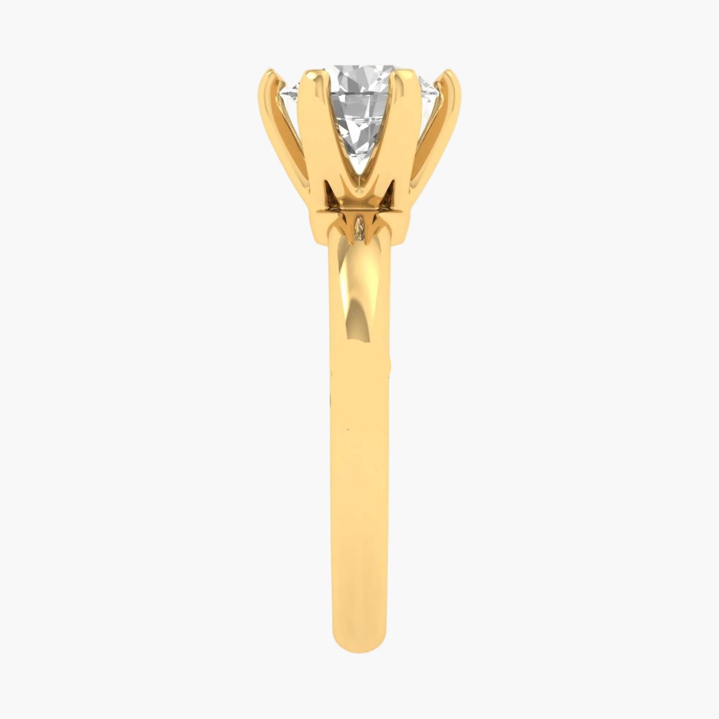 Gold ring with a diamond on a white background