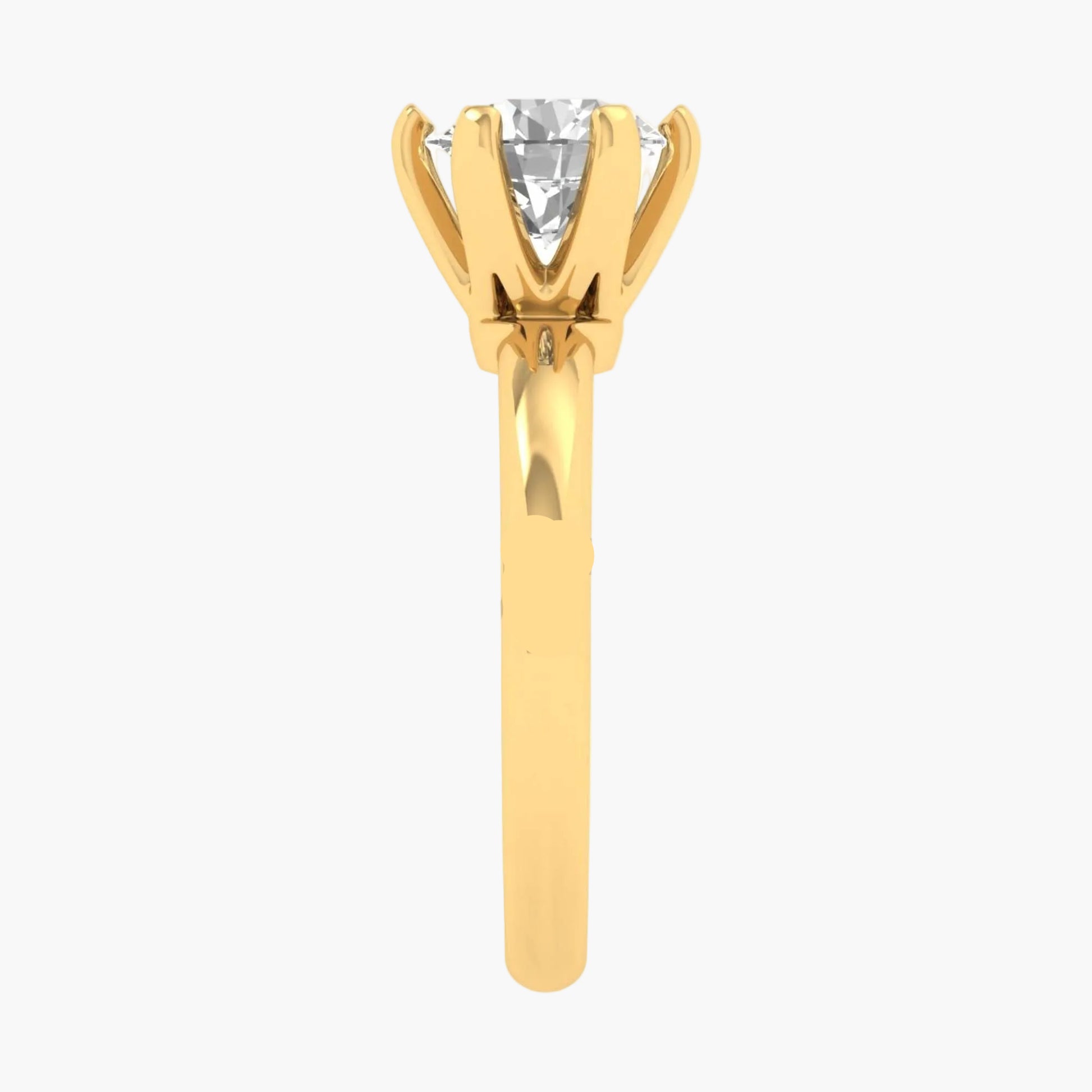 Gold ring with a diamond on a white background