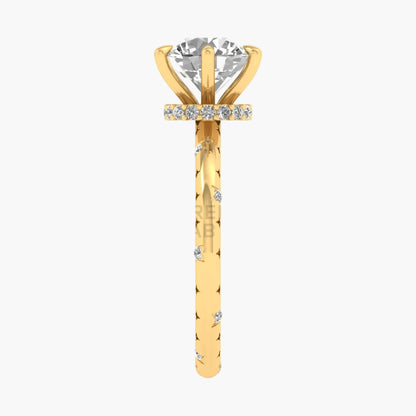 Gold ring with a diamond on a white background
